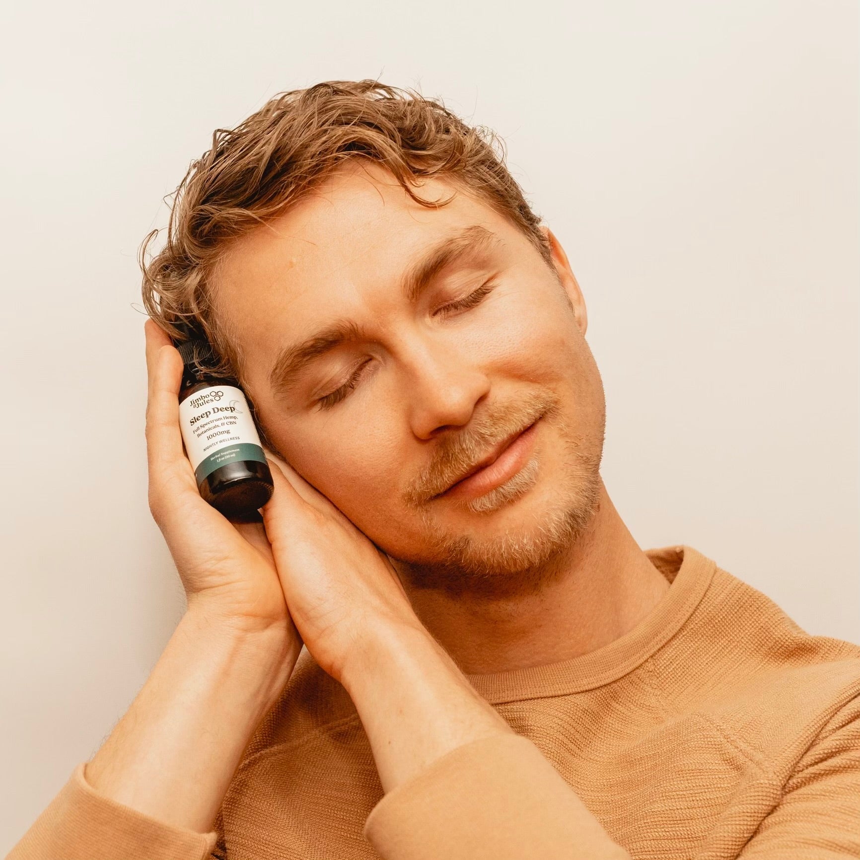 Jimbo from Jimbo & Jules holding Sleep Deep in his hands.